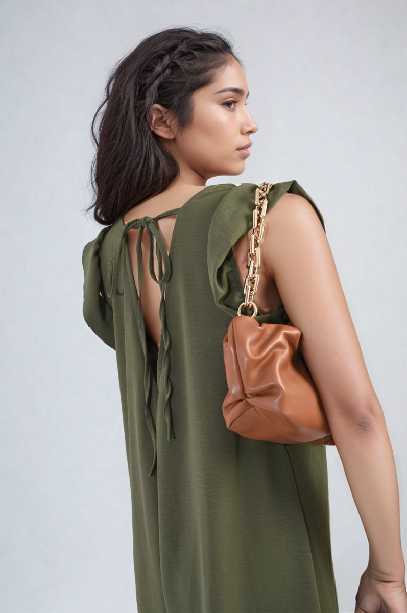 Olive green jumpsuit with V-neck and tied back straps