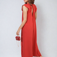 Red wide-leg jumpsuit, V-neck front and ruffle sleeves, side view