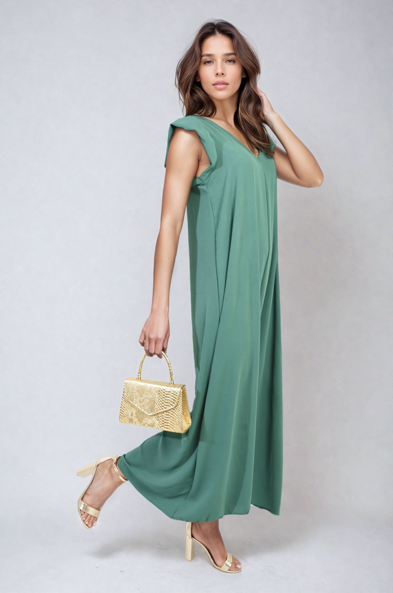 Green wide-leg jumpsuit with V-neck and ruffle sleeves, walking pose