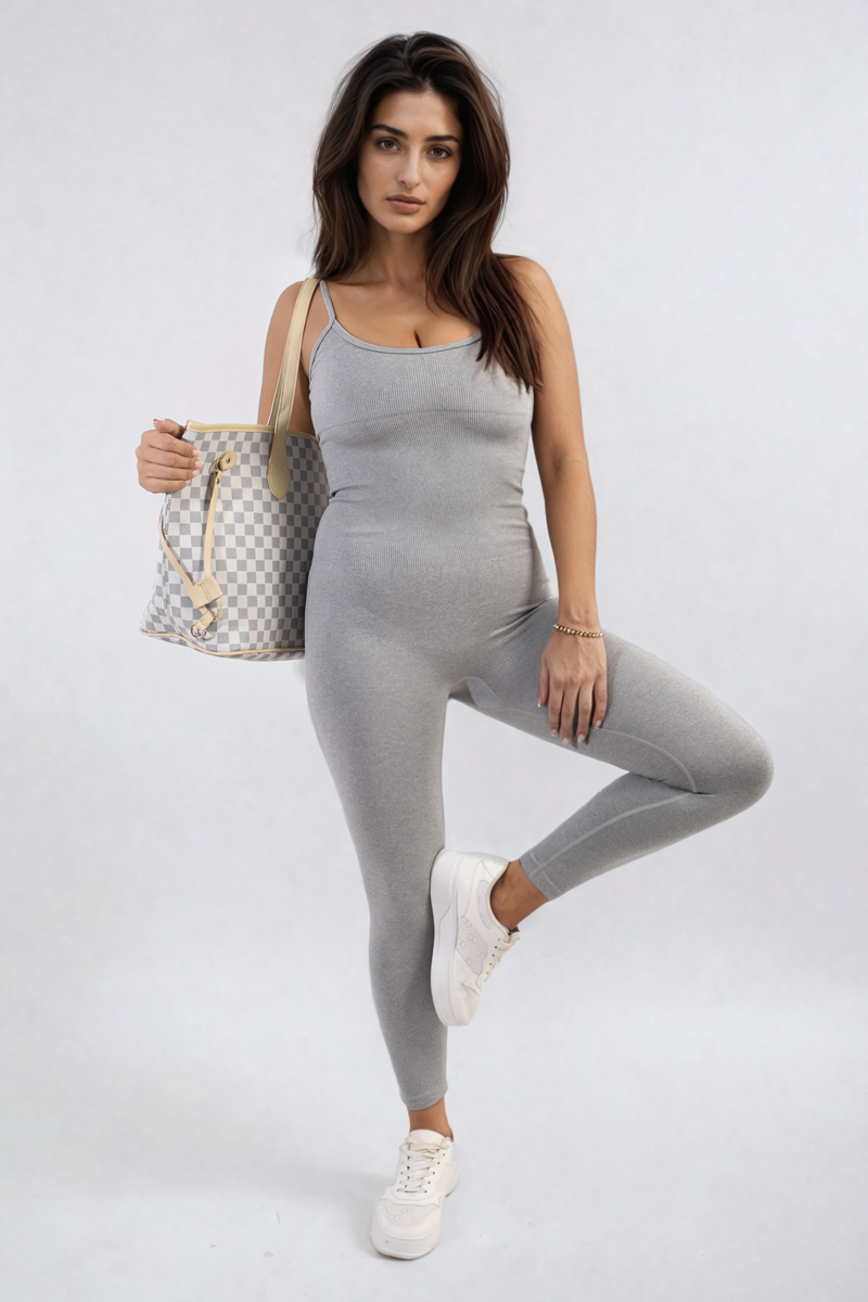 Fitted gray jumpsuit with thin straps and scoop neckline, front three-quarter stance