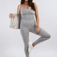 Fitted gray jumpsuit with thin straps and scoop neckline, front three-quarter stance