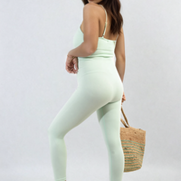 Mint bodycon jumpsuit with scoop neck and slim straps, close-fitting full-length legs