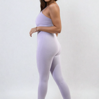 Lilac bodycon jumpsuit with scoop neck and slim straps, smooth fitted long legs