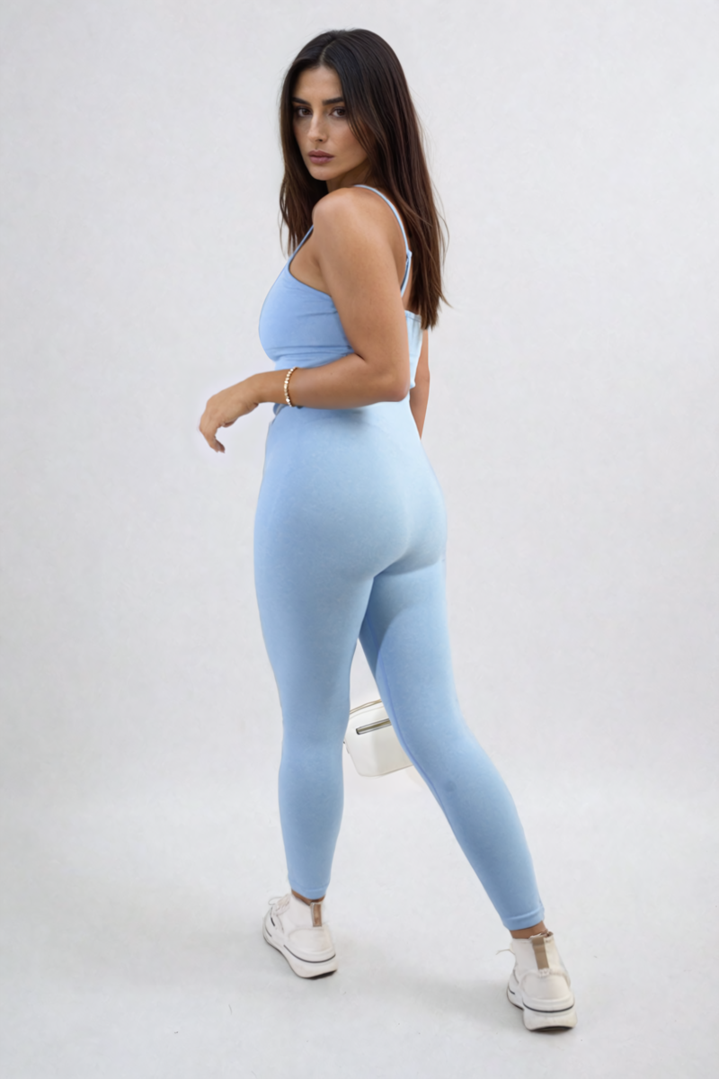 Sky blue bodycon jumpsuit with scoop neck and slim straps, close-fitting long leg