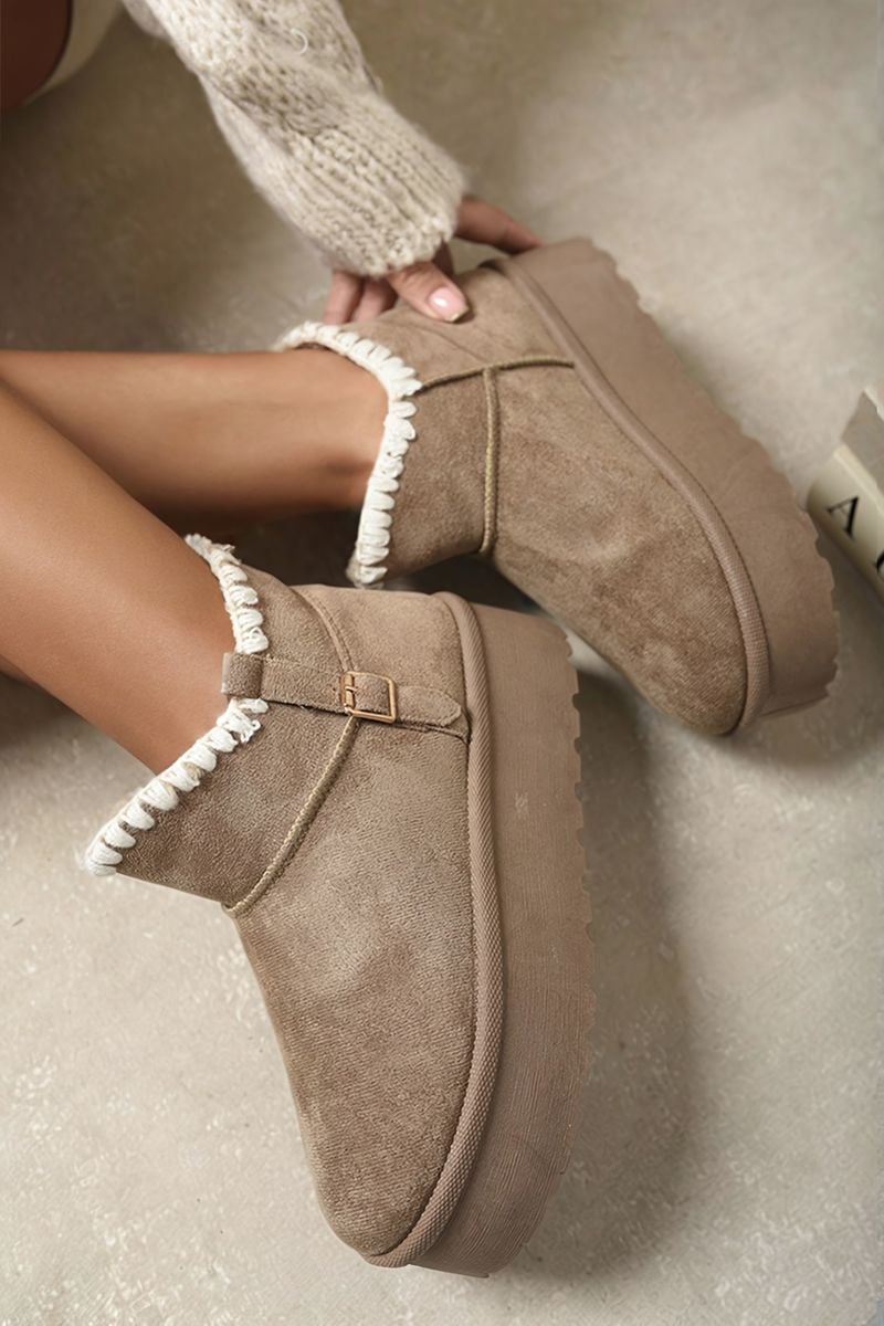 Brown suede ankle boots with faux fur lining, side buckle strap, and chunky platform sole.
