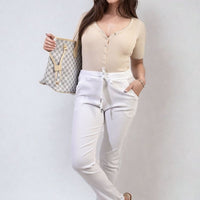 White drawstring tapered trousers with side pockets