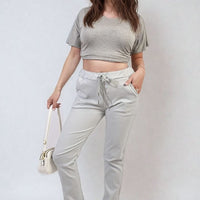 Light grey drawstring tapered trousers with side pockets