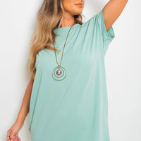 Light blue short-sleeve tunic top with relaxed fit and crew neckline