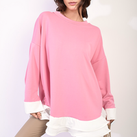 Pink oversized long-sleeve dress top with contrast white ruffle hem