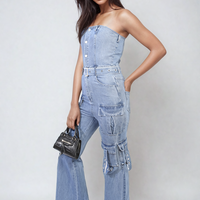 Blue denim strapless cargo jumpsuit with front buttons and multiple utility pockets