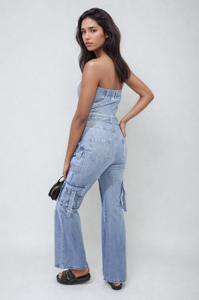 Blue denim strapless cargo jumpsuit with belt, flap pockets, and strapless neckline