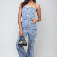 Blue denim strapless cargo jumpsuit with wide leg, front buttons, and cargo pockets