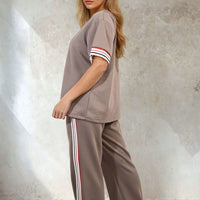 Taupe co-ord set with striped sleeve top and wide-leg trousers with side stripe