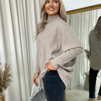 Beige oversized knitted jumper with rhinestone-speckled front and high neckline