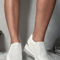 White platform trainers with perforated rhinestone-look uppers and side zip