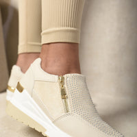 Beige platform trainers with rhinestone toe panel and side zip