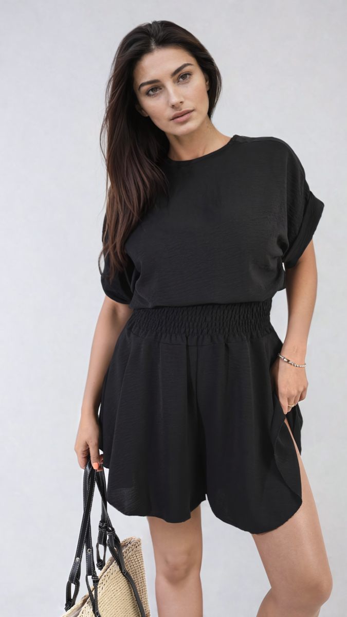 Black roll-sleeve top and elastic shirred waist shorts co-ord set