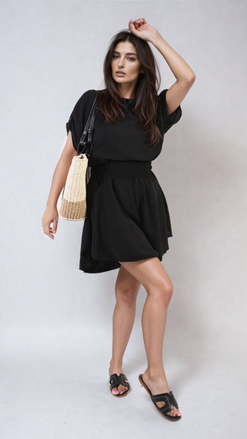Black roll-sleeve top and elastic shirred-waist shorts co-ord set