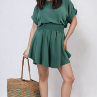 Teal roll-sleeve top and elastic shirred waist shorts co-ord set, standing pose