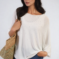 Oversized white round-neck top with studded speckle detail, draped batwing sleeves