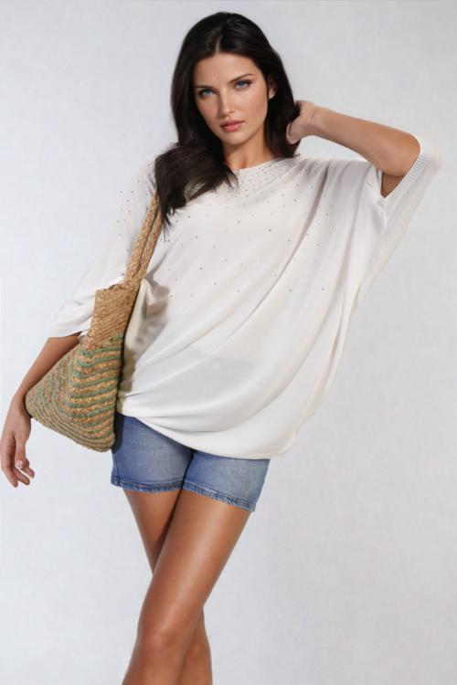 Oversized white round-neck top with studded dot accents on the front