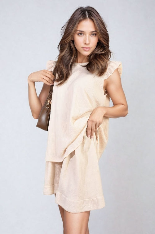 Light cream ruffle-sleeve top and matching shorts set with short layered hem