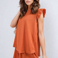 Ruffle-trim sleeve top and shorts set in orange with tiered hem and cap sleeves