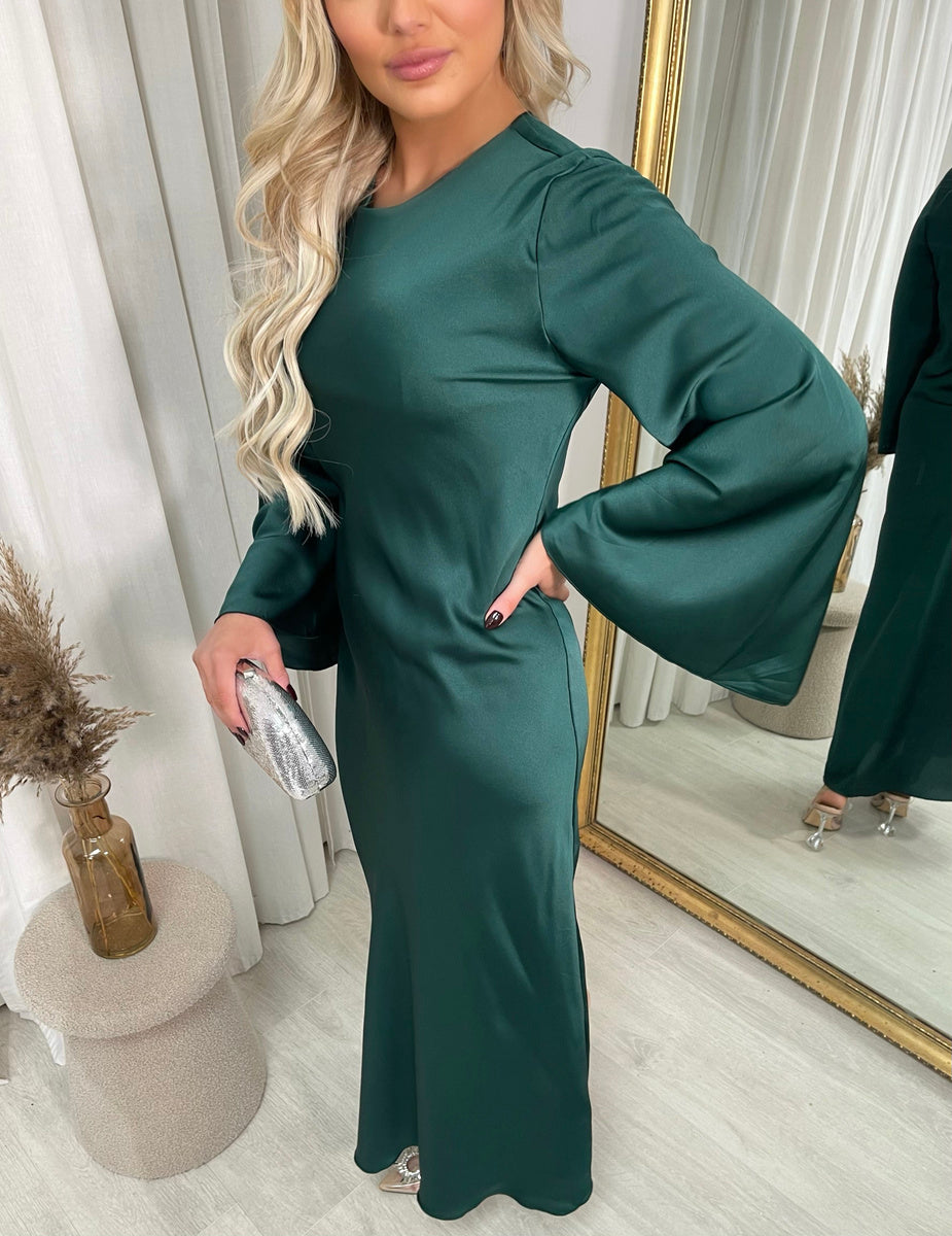 Green round-neck maxi dress with long flared sleeves, side pose