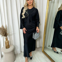 Black maxi dress with round neck and flared sleeves, straight silhouette
