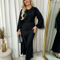 Black maxi dress with round neck and flared bell sleeves, front view