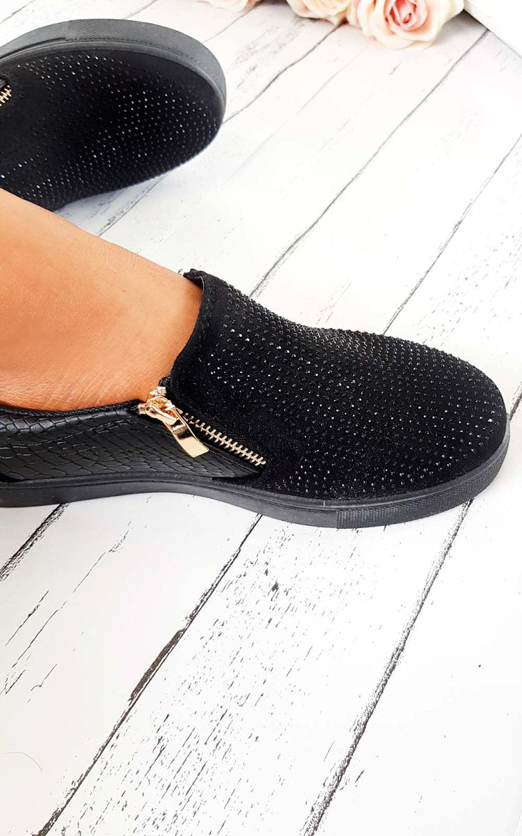 Black slip-on trainer with rhinestone-dotted upper and croc-effect panel, gold zip detail.