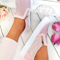 Pink slip-on trainer with diamante front, croc-effect sides, gold zip detail.