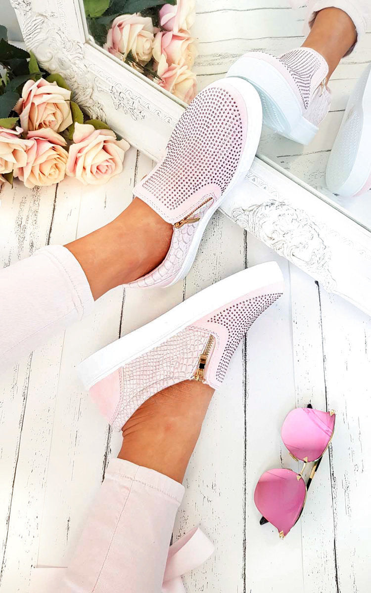 Pink slip-on trainers with diamante-style upper, croc-effect panels, gold zip trim.