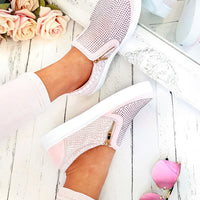 Pink slip-on trainers with diamante-style upper, croc-effect panels, gold zip trim.