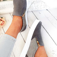 Grey slip-on trainer with diamante-look upper and gold-trim zip front, textured panels.