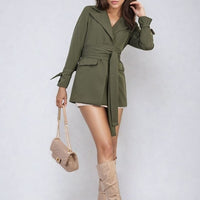 Olive green belted blazer jacket with V-neck and long sleeves, tied waist.