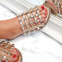 Nude flat slide sandals, studded lattice strap detail with round rhinestone studs
