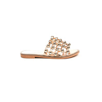 Nude flat slide sandals with studded lattice strap and rhinestone studs, front view