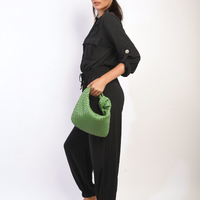 Black button-front collar jumpsuit with drawstring waist and gathered jogger pant legs.