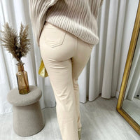 Beige faux leather high-waist trousers with straight legs, button and pockets