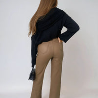 Faux leather trousers in tan with high waist and straight legs, back view