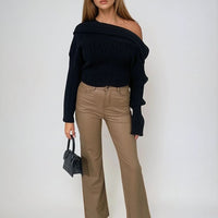 Faux leather trousers in tan with high waist and straight legs, angled standing view