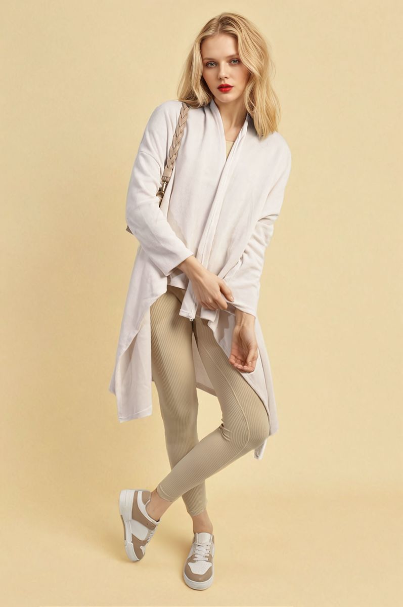 White open-front long knitted cardigan, long sleeves and flowing drape, textured knit.
