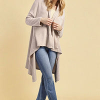 Beige open-front long knitted cardigan with long sleeves and draped hem
