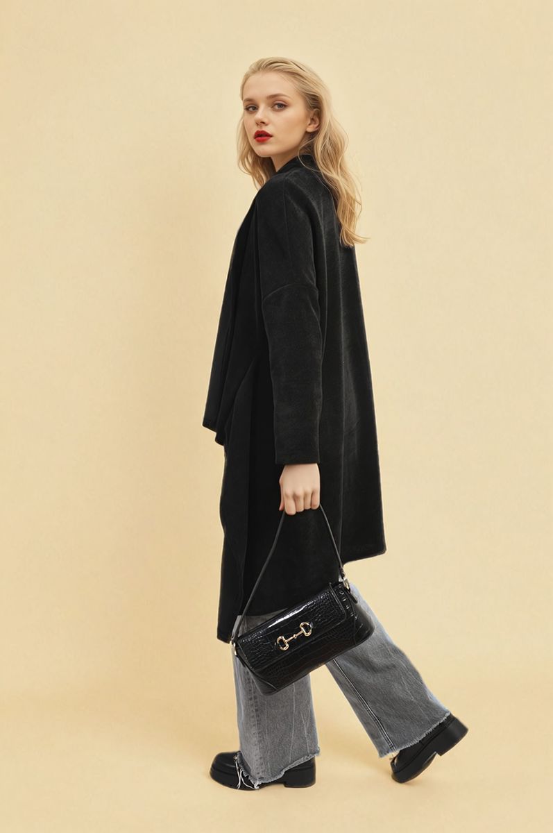 Black open-front long knitted cardigan with draped silhouette, long sleeves.