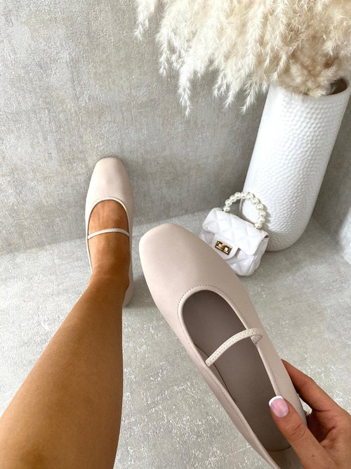 Nude round-toe ballet slip-on flats with thin ankle strap and angled heel