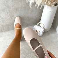 Nude round-toe ballet slip-on flats with thin ankle strap and angled heel