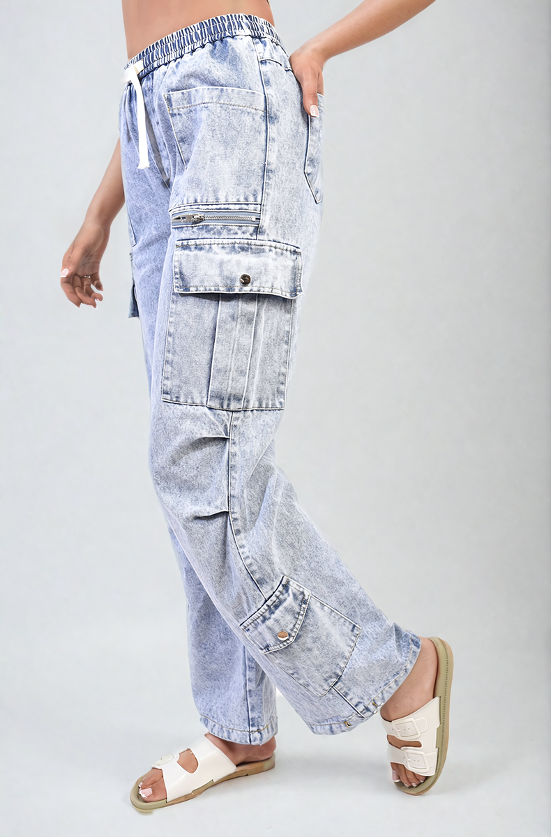 Light blue cargo jeans with drawstring waist and multiple patch pockets, side view
