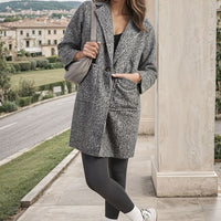 Grey textured button-front long jacket with two front pockets and V-neck opening.