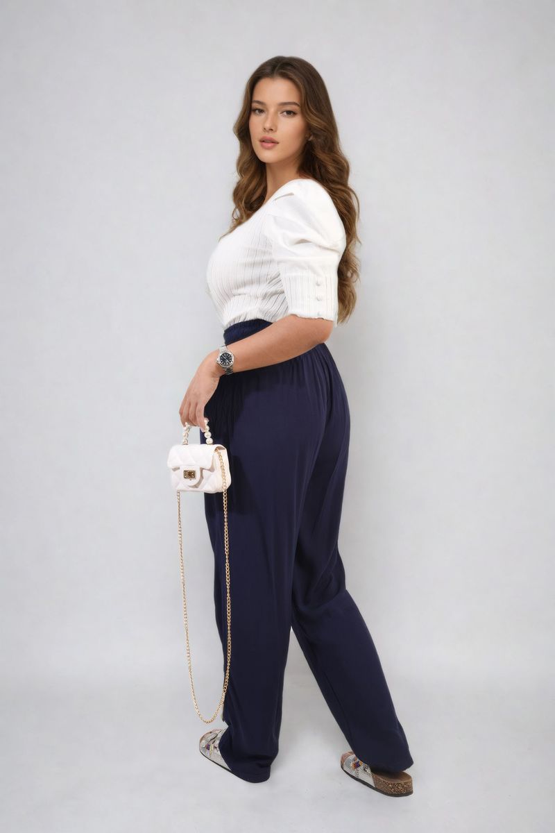 Navy high-waist drawstring trousers with side pockets and relaxed tapered legs